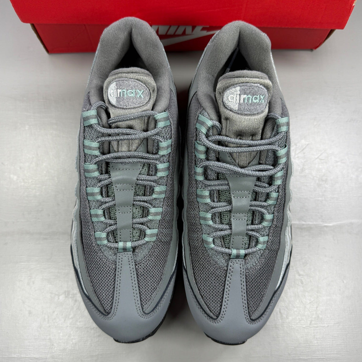 Nike running shoes grey with big bubble design and classic swoosh logo.