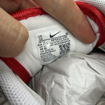 Nike Air Max 1 trainers white with university red accents and cream detailing.