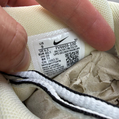 Nike P-6000 white trainers metallic silver accents and mesh detailing.