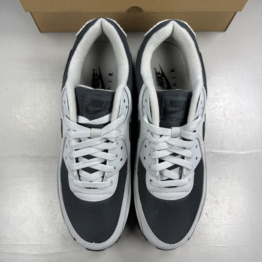Nike trainers light smoke grey with black accents and iconic swoosh logo.