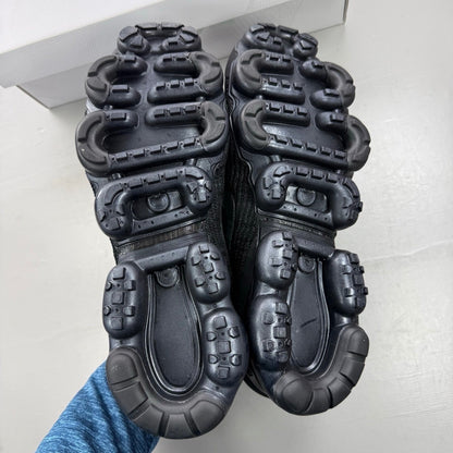 Nike Air VaporMax Flyknit 3 black sneakers with distinctive air cushioning and sleek design.
