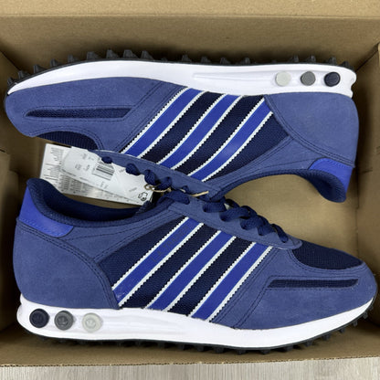 Adidas blue LA Trainers with white stripes and logo detailing on the side.