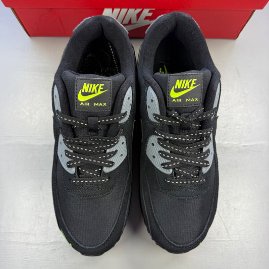Nike Air Max 90 black with volt accents and mini swoosh logo, mesh and synthetic material.