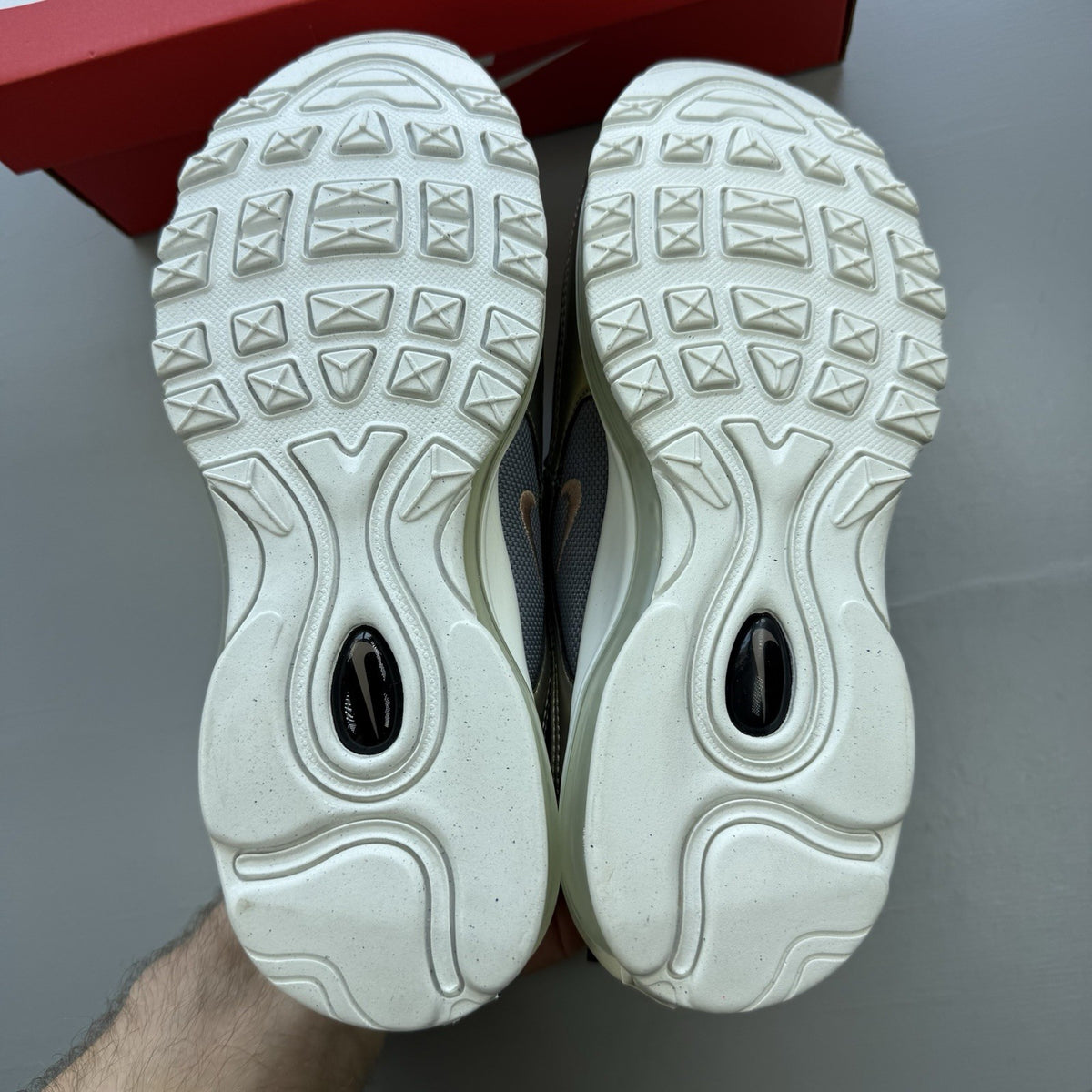 Nike Air Max 97 SE metallic silver trainers with bronze accents and white sole.
