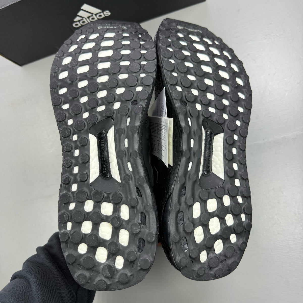 Adidas black Ultra Boost 1.0 trainers with core black and oreo toe design.