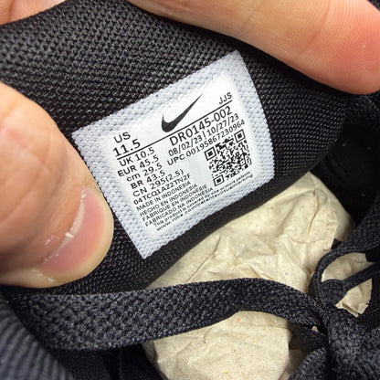 Nike running shoes black with grey accents and logo on the side.