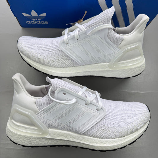 Adidas white trainers with Boost cushioning and iconic three-stripe logo.