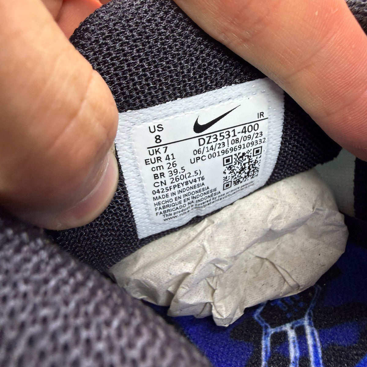 Nike Air Max Plus TN blue trainers with distinctive wave pattern and logo.