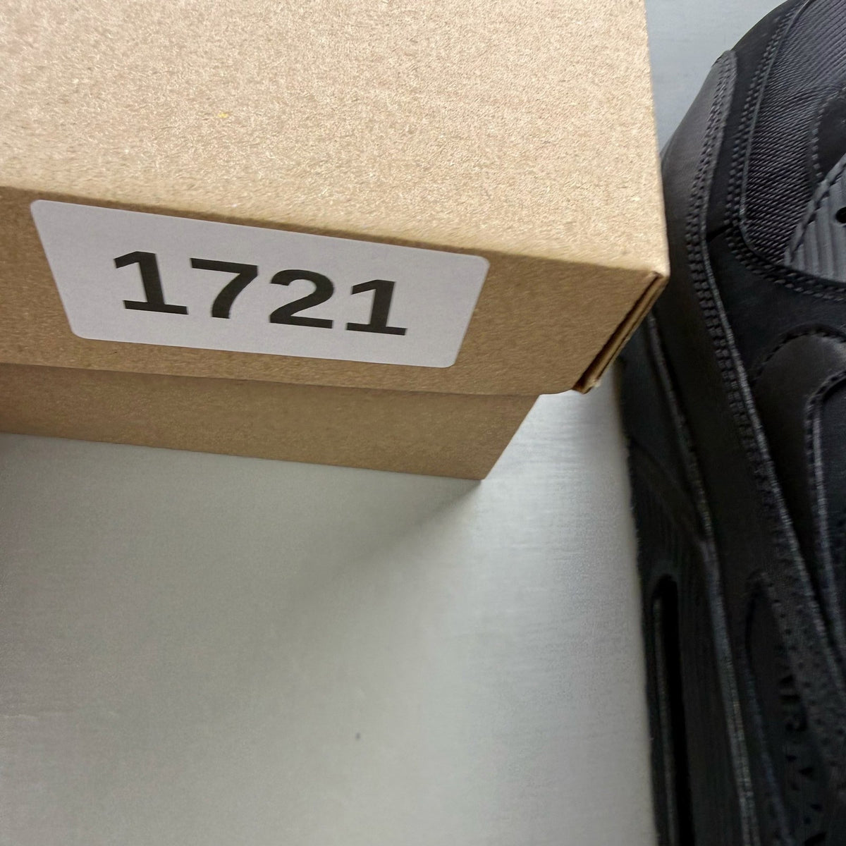 Nike black trainers with iconic Air Max cushioning and sleek design.