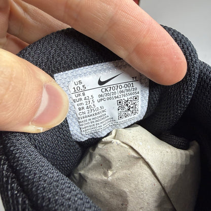 Nike Air Max 95 Essential black trainers with white accents and signature logo details.