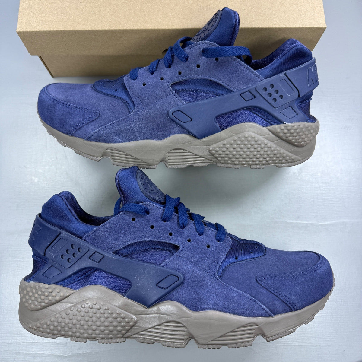 Nike running shoes blue with mesh upper and signature logo detail.