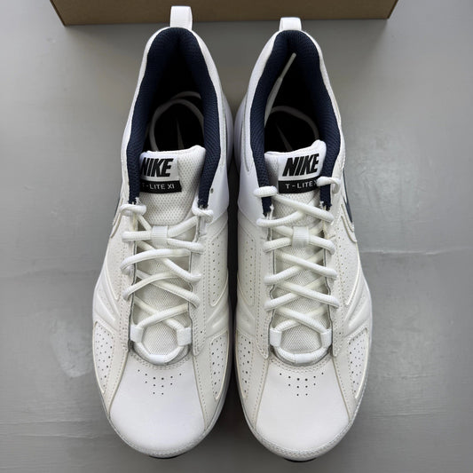 Nike T-Lite XI white trainers with navy and black accents, featuring logo detail.