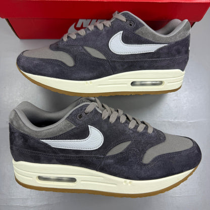 Nike grey deck shoes with premium crepe sole and logo detailing.