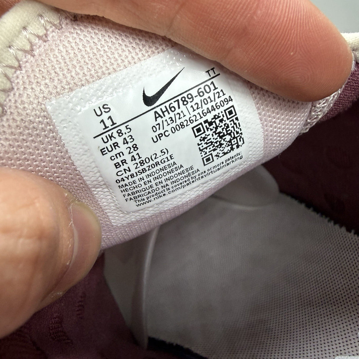 Nike Air Max 270 pink trainers with vintage wine accents and white sole.