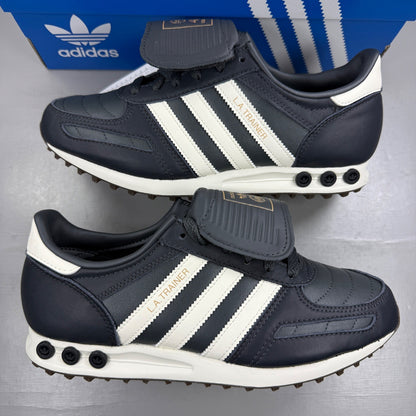 Adidas black deck shoes with blue and white accents, featuring classic logo design.
