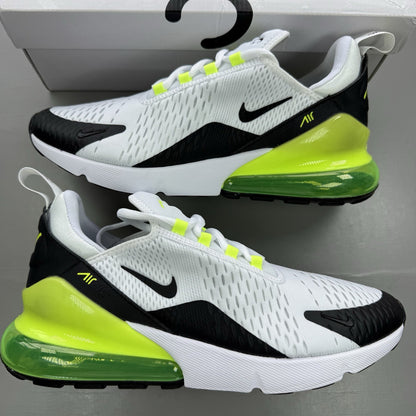 Nike Air Max 270 black trainers with white and volt green accents, mesh material.