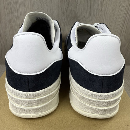 Adidas Gazelle Bold black trainers with white stripes and logo detailing.