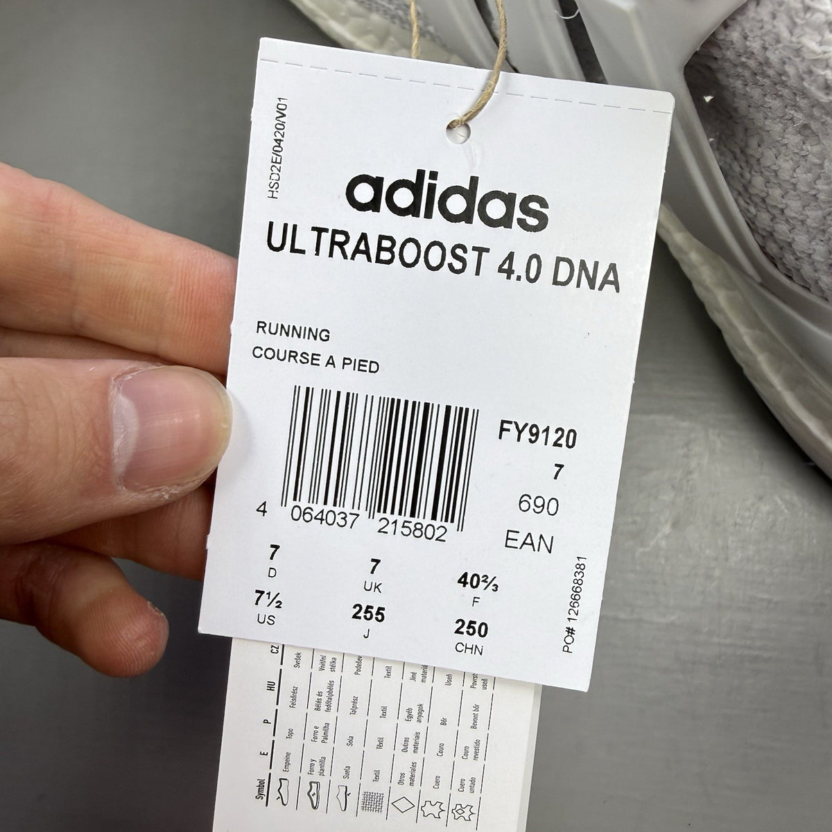 Adidas men's sneakers white with black accents and signature three-stripe logo.
