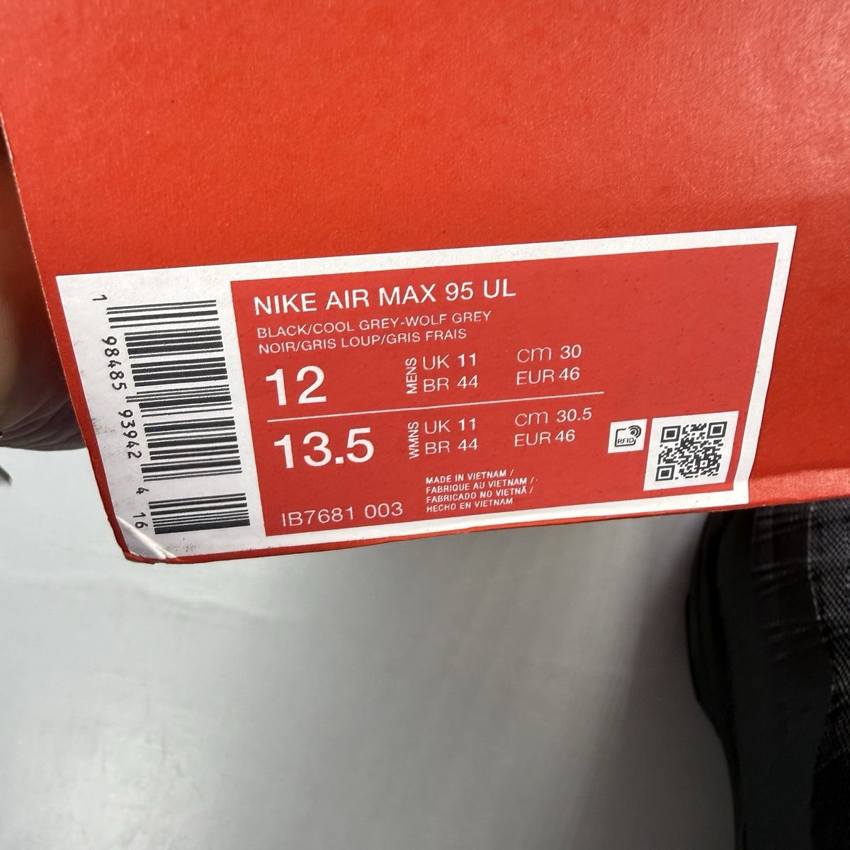Nike Air Max 95 Ultra black trainers with grey accents and signature logo details.