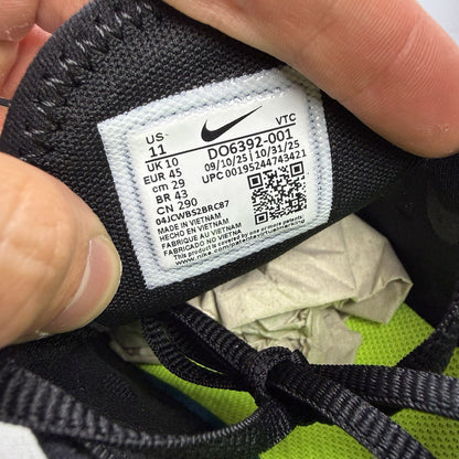 Nike Air Max 270 black trainers with neon volt accents and white sole.