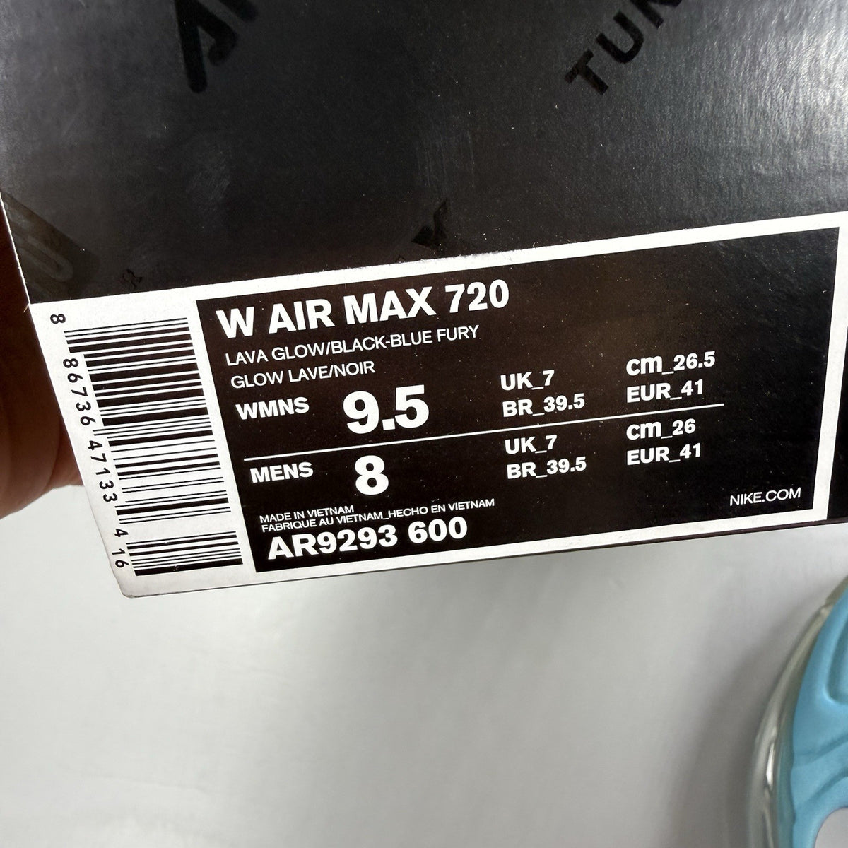 Nike Air Max 720 trainers blue with pink and lava glow accents, mesh upper.