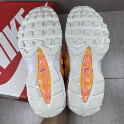 Nike Air Max 95 trainers white with campfire orange accents and signature logo details.