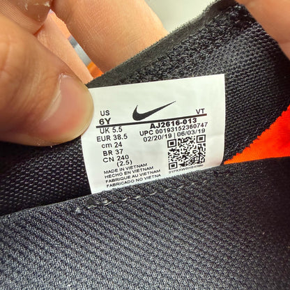 Nike grey trainers with total orange accents and Air VaporMax cushioning.
