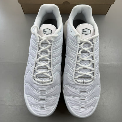 Nike Air Max Plus TN white trainers with grey accents and signature swoosh logo.