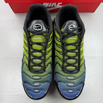Nike Air Max Plus TN green trainers with black and volt accents, featuring signature logo.