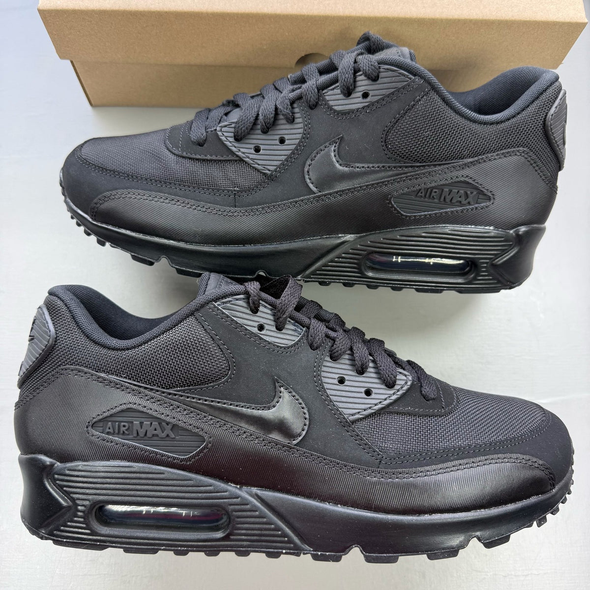 Nike black trainers with iconic Air Max cushioning and sleek design.