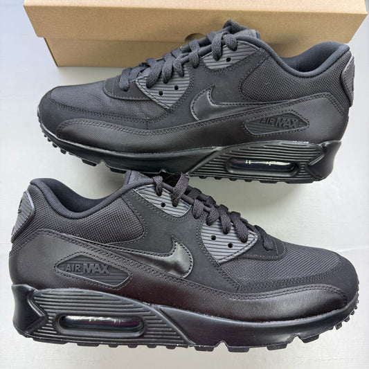 Nike black trainers with iconic Air Max cushioning and sleek design.