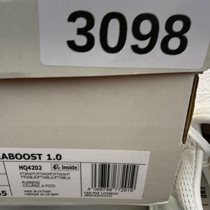 Adidas Ultra Boost 1.0 white running trainers with textured knit upper and signature three stripes.