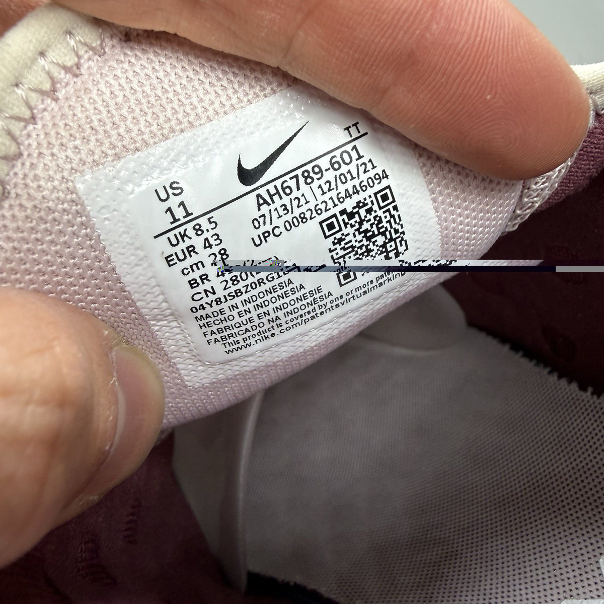 Nike Air Max 270 pink trainers with vintage wine accents and white sole.