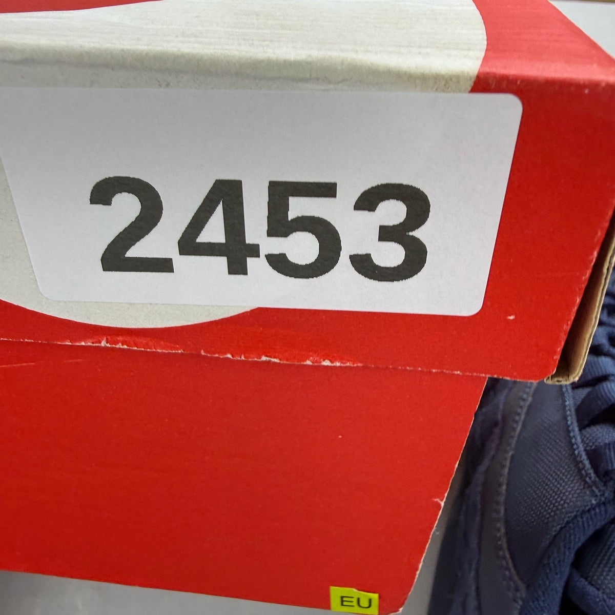 Nike Air Max 95 blue trainers with mesh upper and signature swoosh logo.