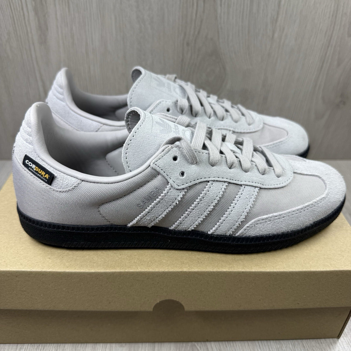 Adidas grey trainers with Cordura material and classic Samba logo detailing.