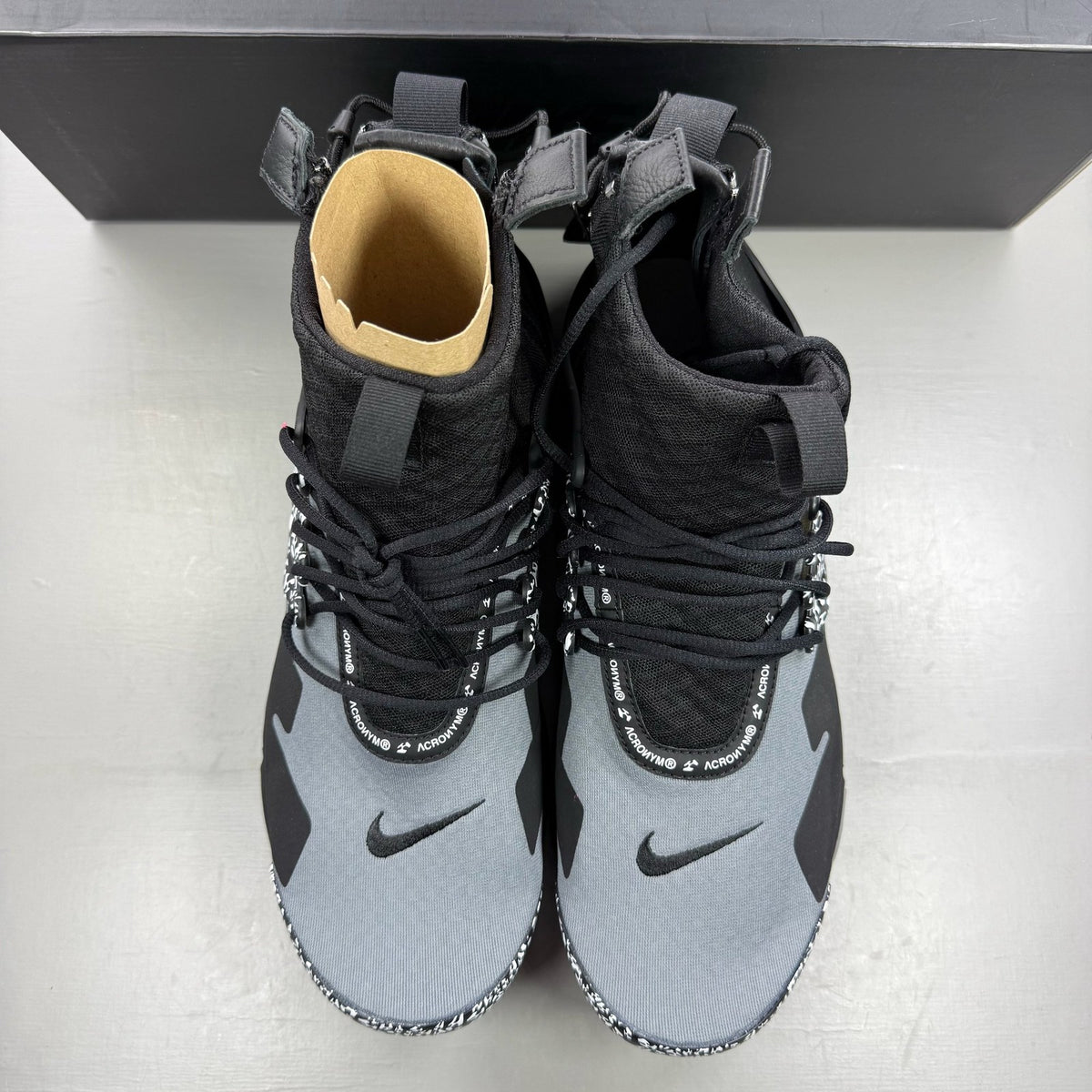 Nike black trainers with Cool Grey accents and Acronym logo details.