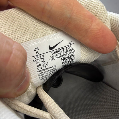 Nike white trainers with light orewood brown accents and swoosh logo.