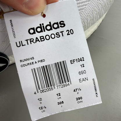 Adidas Ultraboost 20 white trainers with cloud cushioning and iconic three-stripe logo.
