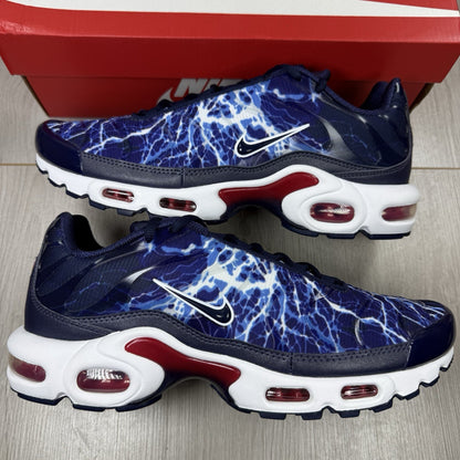 Nike Air Max Plus trainers blue with unique lightning pattern and signature logo.