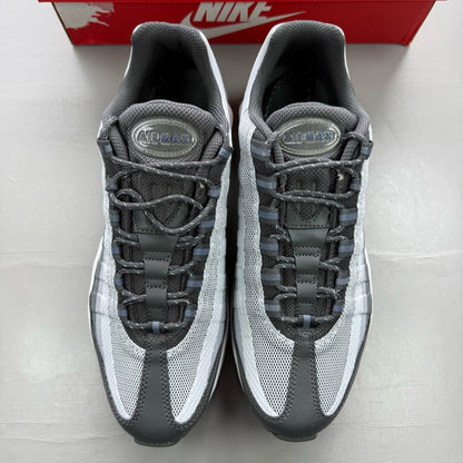 Nike Air Max 95 grey trainers with blue accents and visible logo detailing.