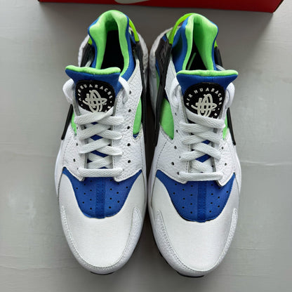 Nike Air Huarache white trainers with scream green and blue accents, mesh material.