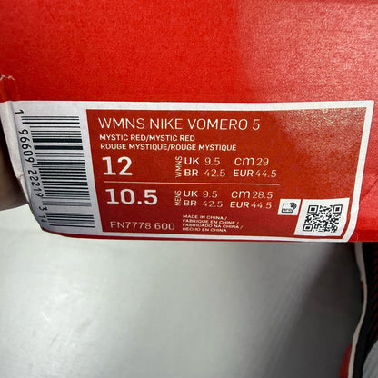 Nike Zoom Vomero 5 black trainers with red accents and white logo details.