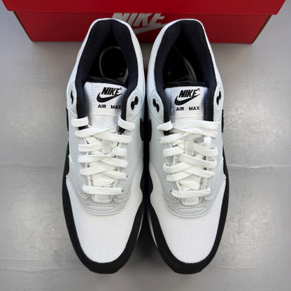 Nike trainers white with black and platinum grey accents, featuring iconic swoosh logo.