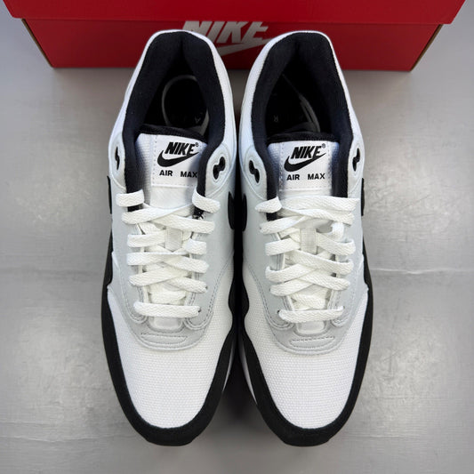 Nike trainers white with black and platinum grey accents, featuring iconic swoosh logo.