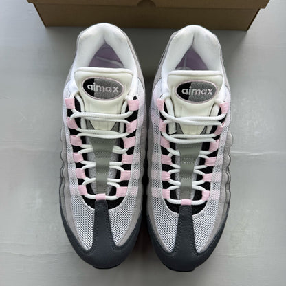 Nike Air Max 95 grey trainers with pink foam accents and black detailing.