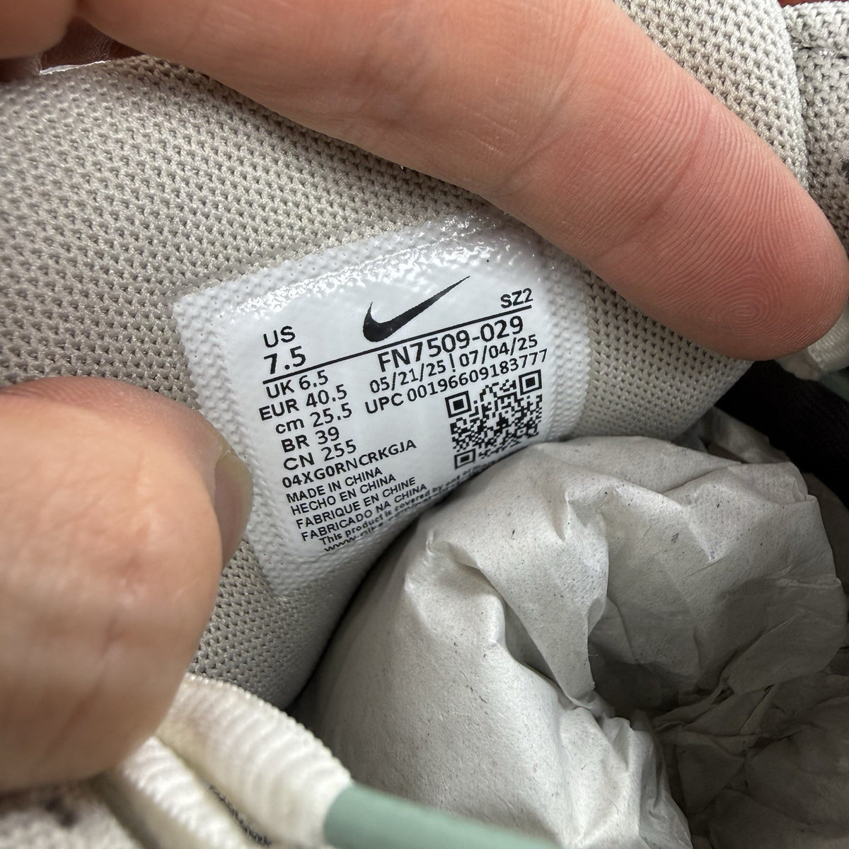 Nike grey P-6000 trainers with mesh upper and reflective detailing.