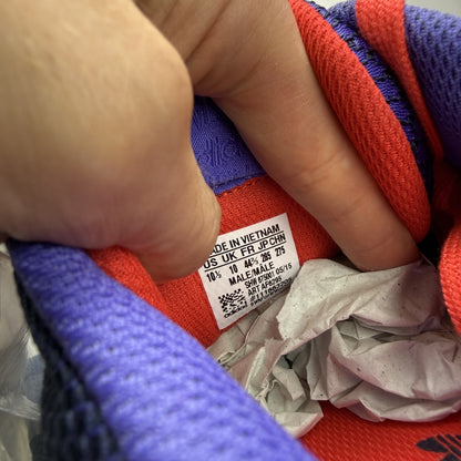 Adidas blue ZX Flux trainers with red and white woven pattern, logo on tongue.