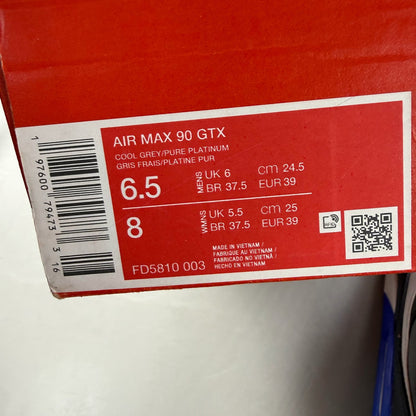 Nike Air Max 90 grey sneakers with Gore-Tex material and blue accents.