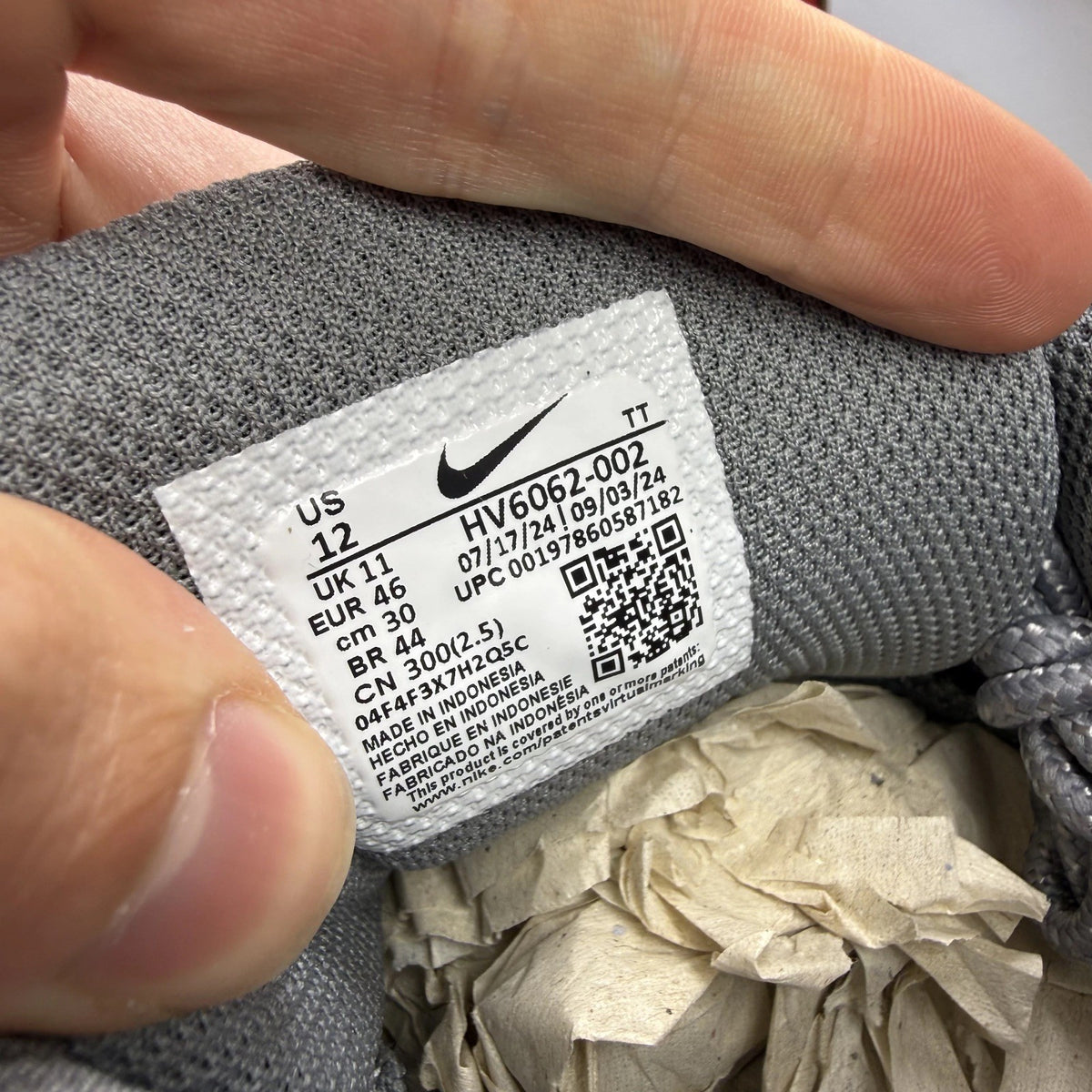 Nike Air Max 95 grey trainers with sundial accents and signature logo details.
