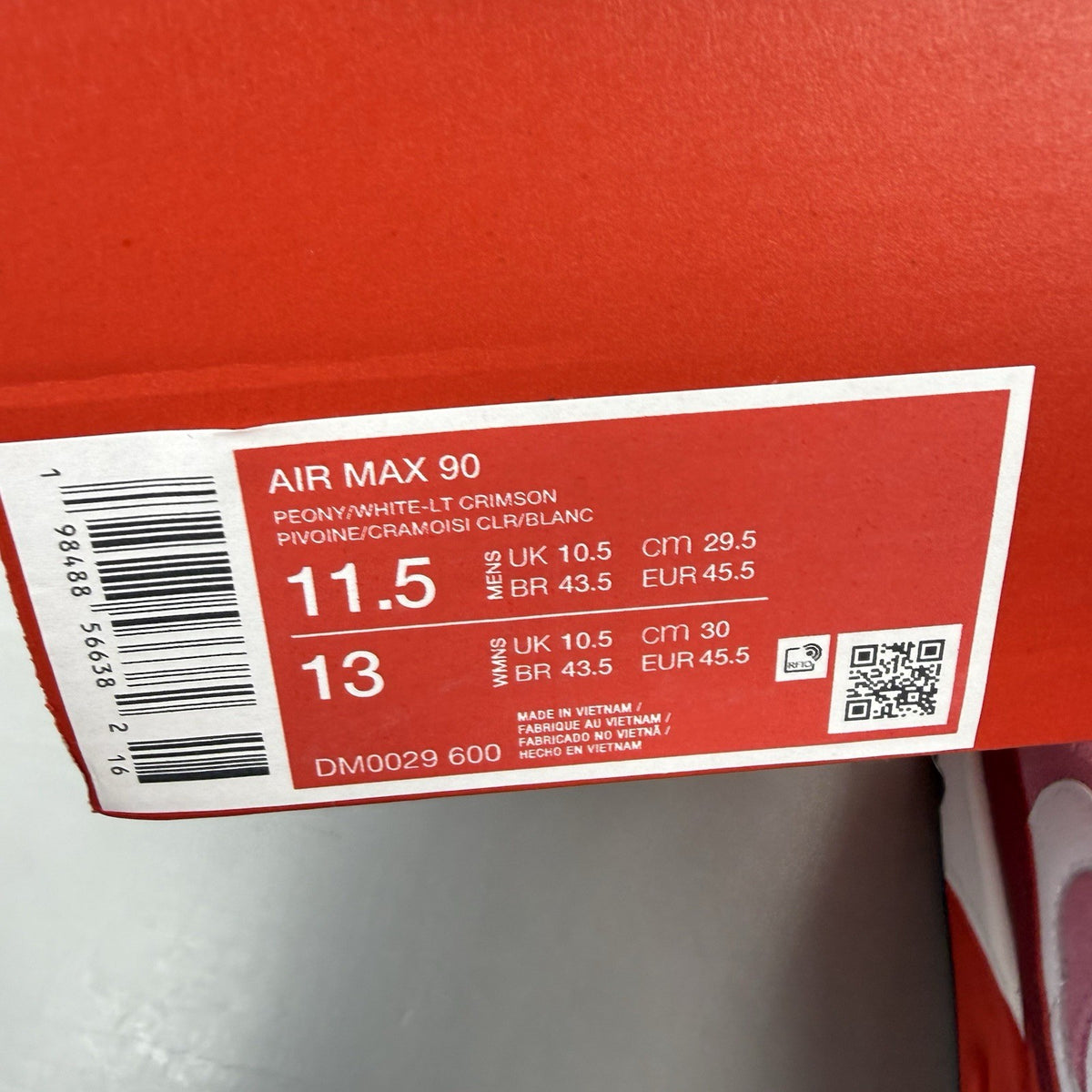 Nike Air Max 90 trainers white with peony and light crimson accents, classic logo.